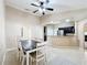 Dining room with a view into the kitchen and breakfast bar at 119 Talavera Ln, Kissimmee, FL 34758