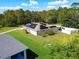 Aerial view of house with solar panels and large backyard at 119 Talavera Ln, Kissimmee, FL 34758