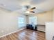 Bedroom with window overlooking patio, and ceiling fan at 119 Talavera Ln, Kissimmee, FL 34758