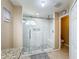 Large walk in shower with marble tile and bench seat at 119 Talavera Ln, Kissimmee, FL 34758