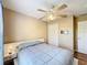 Bedroom with double bed, nightstand and ceiling fan at 119 Talavera Ln, Kissimmee, FL 34758