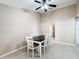 Bright dining room with a farmhouse table and white chairs at 119 Talavera Ln, Kissimmee, FL 34758
