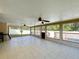 Spacious screened porch with tile flooring and ceiling fans at 119 Talavera Ln, Kissimmee, FL 34758