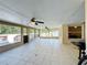 Screened-in porch with tile floor and fans at 119 Talavera Ln, Kissimmee, FL 34758