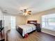 Spacious bedroom with ensuite bathroom access and ceiling fan at 119 Talavera Ln, Kissimmee, FL 34758
