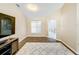Living room with wood-look tile and an arched pass-through at 119 Talavera Ln, Kissimmee, FL 34758