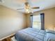Bedroom with double bed, ceiling fan, and window at 119 Talavera Ln, Kissimmee, FL 34758