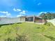 Large backyard with privacy fence and small trees at 119 Talavera Ln, Kissimmee, FL 34758