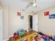 bedroom with Mickey Mouse decor and ceiling fan at 119 Talavera Ln, Kissimmee, FL 34758