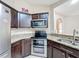 Well-equipped kitchen with stainless steel appliances and granite countertops at 119 Talavera Ln, Kissimmee, FL 34758