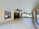 Large screened porch with tile floor and fans at 119 Talavera Ln, Kissimmee, FL 34758