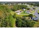 Aerial view showing a house with solar panels and a large backyard in a residential neighborhood at 119 Talavera Ln, Kissimmee, FL 34758