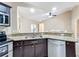 Kitchen features granite countertops, double sink and stainless steel appliances at 119 Talavera Ln, Kissimmee, FL 34758