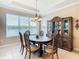 Bright dining room with an oval table, six chairs, and a large hutch at 678 Irvine Ranch Rd, Kissimmee, FL 34759