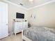 Bedroom with dresser, TV, and a comfortable bed at 678 Irvine Ranch Rd, Kissimmee, FL 34759