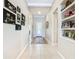 Bright and spacious entryway with tile flooring, built-in shelving, and artwork at 678 Irvine Ranch Rd, Kissimmee, FL 34759