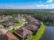 Aerial showing community and lakefront properties at 678 Irvine Ranch Rd, Kissimmee, FL 34759