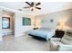Relaxing bedroom with ceiling fan and large window at 678 Irvine Ranch Rd, Kissimmee, FL 34759