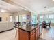 Open kitchen with stainless steel appliances, granite countertops, and wood cabinets at 678 Irvine Ranch Rd, Kissimmee, FL 34759