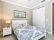 Bright bedroom with a queen-size bed and ample closet space at 678 Irvine Ranch Rd, Kissimmee, FL 34759