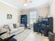Home office with a comfortable couch and workspace at 678 Irvine Ranch Rd, Kissimmee, FL 34759
