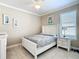 Well-lit bedroom with a queen-size bed and nightstand at 678 Irvine Ranch Rd, Kissimmee, FL 34759