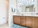 Bathroom featuring double vanity and a large walk-in shower at 678 Irvine Ranch Rd, Kissimmee, FL 34759