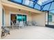 This screened patio offers lake views and plenty of seating at 678 Irvine Ranch Rd, Kissimmee, FL 34759