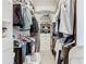 Spacious walk-in closet with shelving and hanging rods at 678 Irvine Ranch Rd, Kissimmee, FL 34759