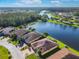 Aerial view of a house by a lake, showing its location within a residential development at 678 Irvine Ranch Rd, Kissimmee, FL 34759