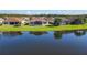 Aerial view of lakefront home with backyard at 678 Irvine Ranch Rd, Kissimmee, FL 34759
