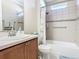 Updated bathroom with a tub, shower, and modern vanity at 678 Irvine Ranch Rd, Kissimmee, FL 34759