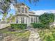Charming two-story house with landscaped yard and walkway at 307 Norfolk St, Celebration, FL 34747