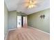 Primary bedroom with carpet, ceiling fan, and ensuite bathroom at 307 Norfolk St, Celebration, FL 34747