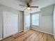 Bright bedroom with double doors and ceiling fan at 307 Norfolk St, Celebration, FL 34747