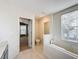 Bathroom featuring a toilet, bathtub and access to bedroom at 307 Norfolk St, Celebration, FL 34747
