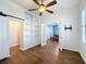 Bright home office with built-in shelving and hardwood floors at 307 Norfolk St, Celebration, FL 34747