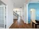 Bright entry hall with hardwood floors and staircase leading to the second floor at 307 Norfolk St, Celebration, FL 34747