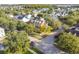 An aerial view of a brick home in a tree-lined neighborhood at 307 Norfolk St, Celebration, FL 34747