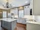 Modern kitchen with white cabinets, marble countertops, and stainless steel appliances at 307 Norfolk St, Celebration, FL 34747