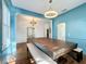 Elegant dining room features a large wood table, blue walls, and plantation shutters at 307 Norfolk St, Celebration, FL 34747