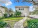 Detached guest house with pathway and lush landscaping at 307 Norfolk St, Celebration, FL 34747