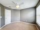 Simple bedroom with ceiling fan, carpet, and neutral walls at 307 Norfolk St, Celebration, FL 34747
