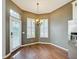 Breakfast nook with wood floors, chandelier, and access to backyard at 307 Norfolk St, Celebration, FL 34747