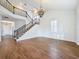 Spacious living room with hardwood floors and a grand staircase at 307 Norfolk St, Celebration, FL 34747
