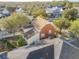 Brick home's rear elevation and surrounding neighborhood shown from above at 307 Norfolk St, Celebration, FL 34747