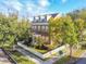 Two-story brick home with white picket fence and landscaping at 307 Norfolk St, Celebration, FL 34747