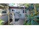 Landscaped side yard with a birdbath and walkway at 112 10Th St, St Cloud, FL 34769