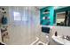 Clean bathroom with a teal shower/tub combo at 112 10Th St, St Cloud, FL 34769