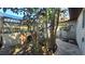 Landscaped side yard with a stone birdbath and mature trees at 112 10Th St, St Cloud, FL 34769